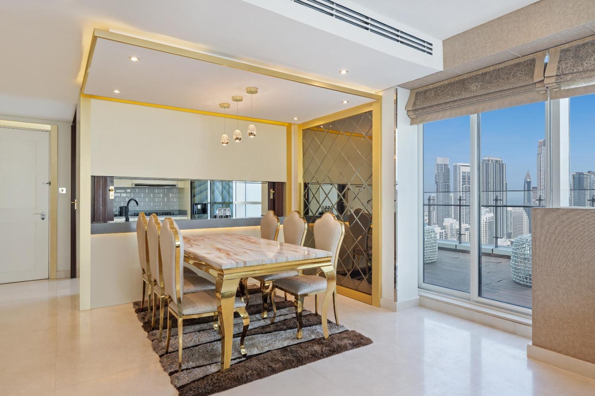 Damac Maison Distinction Dubai Exterior photo A dining room in a luxury apartment